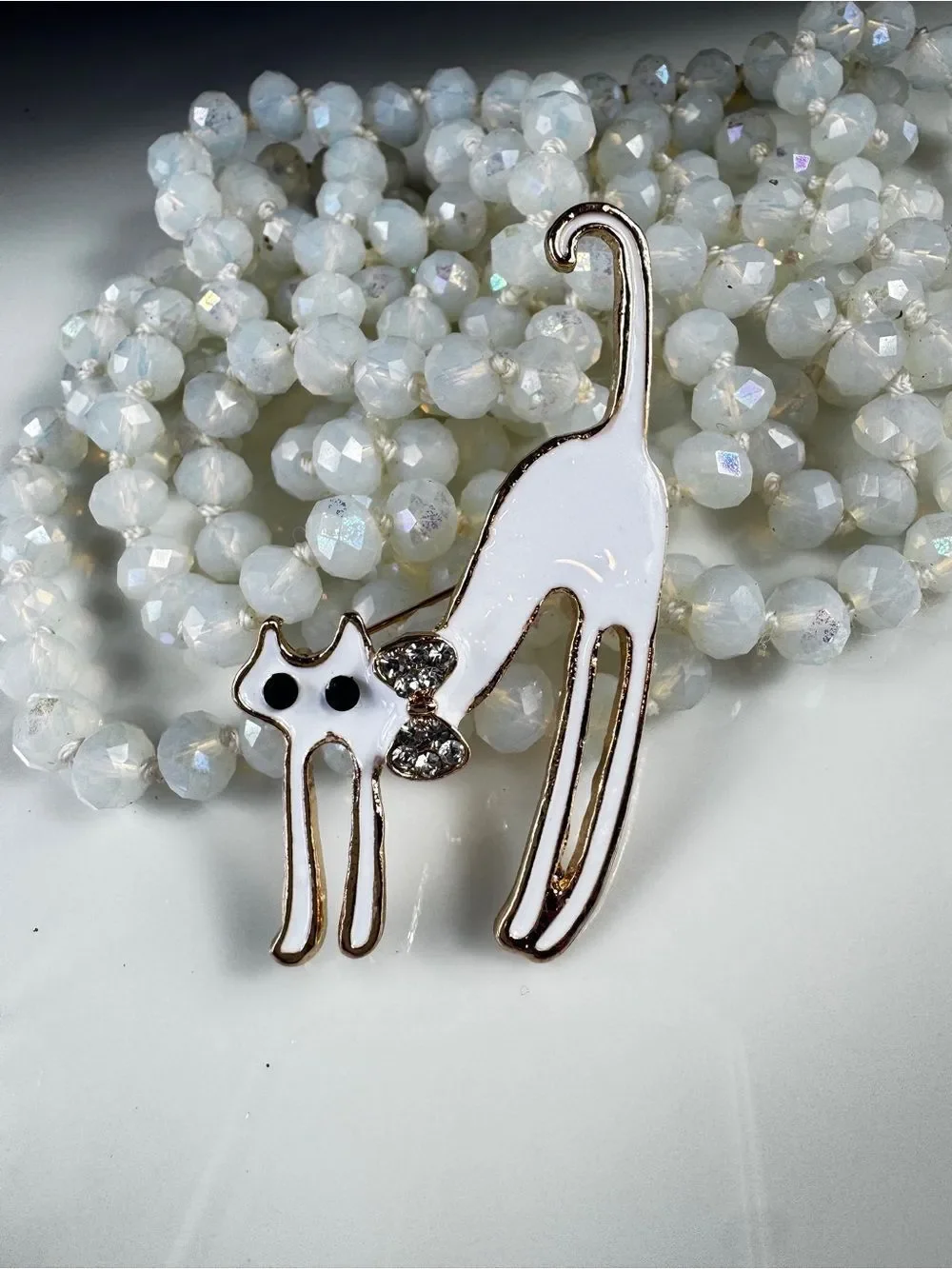 Vintage White Cat Brooch with Rhinestone Bow